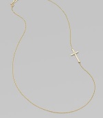 A wispy chain of 14k yellow gold features a cross pendant, punctuated by a single sparkling diamond, set askew for a modern edge.Diamond, .02 tcw 14k yellow gold Length, about 16 Pendant length, about ¾ Spring ring clasp Made in USA