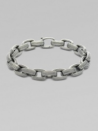A handsome linked design, intricately textured in sterling silver. From the Royal Cord Collection Sterling silver Clasp closure About 8½ long Imported 