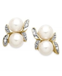 A natural choice. These earrings, crafted from 10k gold, exudes elegance with cultured freshwater pearls (5 mm) and diamond accents along a whimsical leaf motif. Approximate drop: 5/8 inch. Approximate width: 1/3 inch A natural choice. These earrings, crafted from 10k gold, exudes elegance with cultured freshwater pearls (5 mm) and diamond accents along a whimsical leaf motif. Approximate drop: 5/8 inch. Approximate width: 1/3 inch