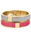 A totally dynamic duo. Betsey Johnson's two bangle set makes quite the statement in chic, contrasting colors. Crafted in gold-plated mixed metal with a glitter overlay and secure hinge clasp. Approximate length: 8 inches. Approximate diameter: 2-1/2 inches.