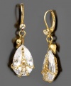 Enhance your charm with big crystal teardrops decked out in Betsy Johnson's signature style. Earrings feature goldtone chains and small heart charms finished with crystal accents. Approximate drop: 1-1/2 inches.