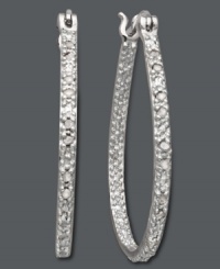 Dazzling hoops fit for a diva. Victoria Townsend adds glam to these oval-shaped hoops with dozens of round-cut diamonds (1/4 ct. t.w.). Set in sterling silver. Approximate diameter: 1-3/10 inches. Dazzling hoops fit for a diva. Victoria Townsend adds glam to these oval-shaped hoops with dozens of round-cut diamonds (1/4 ct. t.w.). Set in sterling silver. Approximate diameter: 1-3/10 inches.