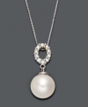 A traditional pearl pendant with an intricate touch. Belle de Mer necklace highlights a cultured freshwater pearl drop (9-10 mm) suspended from an oval-shaped, cut-out bail decorated in sparkling diamonds (1/5 ct. t.w.). Setting and chain crafted in 14k white gold. Approximate length: 18 inches. Approximate drop: 3/4 inch.