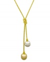 From the island of Mallorca, Spain, this love knot lariat pendant features white and champagne organic man-made baroque pearls (14 mm) set in 18k gold over sterling silver. Approximate length: 16-18 inches. Approximate drop: 1 inch.