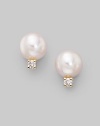From the Akoya Collection. Classic white cultured pearl studs with sparkling diamond accents set in 18k gold. 6mm white round cultured pearls Diamonds, 0.06 tcw 18k yellow gold Post back Imported