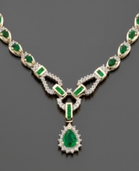 This exquisite royalty-inspired design presents emeralds (8-1/3 ct. t.w.) fully surrounded by diamonds (1-1/5 ct. t.w) in a dramatic 14k gold toggle-style drop necklace. Approximate length: 17 inches. This exquisite royalty-inspired design presents emeralds (8-1/3 ct. t.w.) fully surrounded by diamonds (1-1/5 ct. t.w) in a dramatic 14k gold toggle-style drop necklace. Approximate length: 17 inches.
