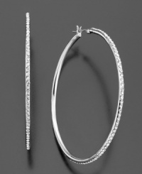 Dreamy and dazzling, these gorgeous hoop earrings by Lauren by Ralph Lauren feature channel-set round-cut crystal accents set in silvertone rhodium-plated mixed metal with surgical steel posts. Approximate diameter: 2 inches. Dreamy and dazzling, these gorgeous hoop earrings by Lauren by Ralph Lauren feature channel-set round-cut crystal accents set in silvertone rhodium-plated mixed metal with surgical steel posts. Approximate diameter: 2 inches.