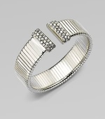 An elegantly ribbed, flexible cuff with Swarovski crystal caps.CrystalSilverplatedDiameter, about 2¼Made in Italy