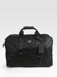 Tessuto nylon travel bag with adjustable shoulder strap for superior comfort.Top handleZip closureInterior pocketsFully lined20½W x 13H x 12DMade in Italy Tessuto nylon travel bag with adjustable shoulder strap for superior comfort.Top handleZip closureInterior pocketsFully lined20½W x 13H x 12DMade in Italy