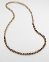 An artistic design with faceted beads on a double link chain. Glass beadsGoldtone brassLength, about 35Slip-on styleImported 