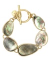 Boho, free-spirited style. This captivating bracelet from Jones New York flaunts brown mother-of-pearl shell accents set in worn gold tone mixed metal with toggle closure. Approximate length: 7-3/4 inches.