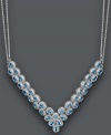 Give new meaning to a plunging neckline. This glamorous v-shaped necklace features two beautiful rows of oval-cut blue topaz (20 ct. t.w.). Set in sterling silver with a double chain design. Approximate length: 18 inches. Approximate drop width: 3 inches.