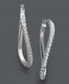 A simple twist and a lot of shine. These unique hoop earrings feature a twisted design accented by dozens of sparkling diamonds. Set in sterling silver. Approximate drop length: 1-1/2 inches. Approximate drop width: 1 inch.