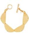 Divine golden discs. This gold-plated Kenneth Cole New York bracelet is composed of geometric gold-tone discs with pave crystal accents and a gold-tone toggle closure. Approximate length: 7-1/2 inches.