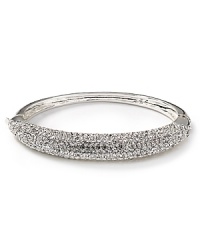 All-around crystals embed a studded, polished bangle from Lauren Ralph Lauren. All-around crystals embed a studded, polished bangle from Lauren Ralph Lauren.