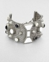 A wide cuff of silvery mesh is dotted with faceted glass stones and studs, plus a bow-shaped centerpiece in front.GlassSilvertone finishLength, about 7Bold spring ring claspImported