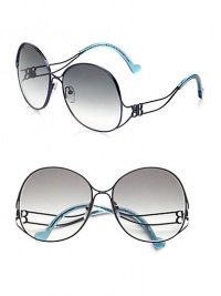 This curvy style boasts a thin, round shape with a unique, framed temple. Available in brown with brown gradient lens or blue with grey gradient lens. Logo temples100% UV protectionMade in Italy This curvy style boasts a thin, round shape with a unique, framed temple. Available in brown with brown gradient lens or blue with grey gradient lens. Logo temples100% UV protectionMade in Italy