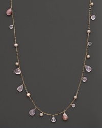 Faceted teardrops of rose quartz and pink shell mingle with freshwater pearls on this long, elegant 14K yellow gold chain. Faceted teardrops of rose quartz and pink shell mingle with freshwater pearls on this long, elegant 14K yellow gold chain.