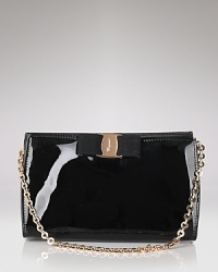 A signature grosgrain bow lends polished sophistication to Salvatore Ferragamo's glossy patent leather mini bag. A signature grosgrain bow lends polished sophistication to Salvatore Ferragamo's glossy patent leather mini bag.