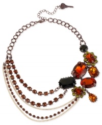 Layer on loveliness with Betsey Johnson's asymmetrical necklace. Chains in gold and brown tones display topaz crystal cupchains, geometric crystal gem clusters and beads. Crafted in gold tone mixed metal. Approximate length: 16 inches + 3-inch extender. Approximate drop: 2 inches. Layer on loveliness with Betsey Johnson's asymmetrical necklace. Chains in gold and brown tones display topaz crystal cupchains, geometric crystal gem clusters and beads. Crafted in gold tone mixed metal. Approximate length: 16 inches + 3-inch extender. Approximate drop: 2 inches.