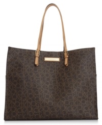Standout in signature style with this take-anywhere tote from Calvin Klein, featuring the iconic CK monogram. Soft leather trim, gleaming hardware and spacious interior make this silhouette an every season essential. Standout in signature style with this take-anywhere tote from Calvin Klein, featuring the iconic CK monogram. Soft leather trim, gleaming hardware and spacious interior make this silhouette an every season essential.