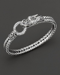 Eastern elements inform John Hardy's dragon head bracelet. It features a polished silver link band and dragon head clasp with round white topaz clasp. Eastern elements inform John Hardy's dragon head bracelet. It features a polished silver link band and dragon head clasp with round white topaz clasp.