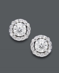 Style fit for a star. Wear this sparkling pair for any occasion, but be prepared to turn heads. Round-cut diamonds (2 ct. t.w.) shine amongst a halo of diamond accents. Crafted in 14k white gold. Approximate diameter: 9-2/10 mm. Style fit for a star. Wear this sparkling pair for any occasion, but be prepared to turn heads. Round-cut diamonds (2 ct. t.w.) shine amongst a halo of diamond accents. Crafted in 14k white gold. Approximate diameter: 9-2/10 mm.