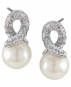 Add a simple twist. Carolee's elegant knot-shaped stud earrings feature a post backing with polished glass pearls and sparkling glass accents. Set in silver tone mixed metal. Approximate drop: 3/4 inch.
