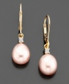 Charming earrings comprised of pink pear-shaped cultured freshwater pearls and pretty diamond accents. Set in 14k gold.