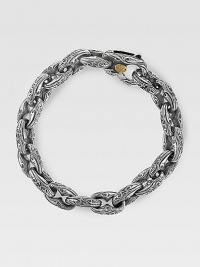 Fine, sterling silver links are styled with handsome Sparta engraving. 18K gold-accent lobster claw clasp About 8½ long Made in USA Fine, sterling silver links are styled with handsome Sparta engraving. 18K gold-accent lobster claw clasp About 8½ long Made in USA