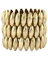 Cuff it out. Edgy oval beads form a three-row design that's a total knockout on Jessica Simpson's stretch cuff bracelet. Set in gold tone mixed metal. Approximate length: 8 inches.