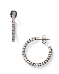 Crystal-studded hoops make a powerful impact. From Crislu, with fine cubic zirconia set in sterling and platinum. Crystal-studded hoops make a powerful impact. From Crislu, with fine cubic zirconia set in sterling and platinum.