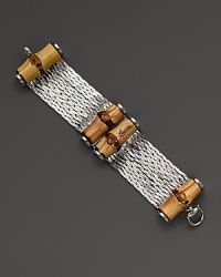 Gleaming sterling silver and bamboo mix for a stunning combination of luxurious and organic. By Gucci. Gleaming sterling silver and bamboo mix for a stunning combination of luxurious and organic. By Gucci.