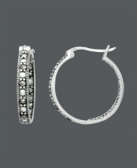 Sparkle that shines from the inside out. A stylish spin on the traditional hoop, Genevieve & Grace design features glittering marcasite in sterling silver. Approximate diameter: 7/8 inch. Sparkle that shines from the inside out. A stylish spin on the traditional hoop, Genevieve & Grace design features glittering marcasite in sterling silver. Approximate diameter: 7/8 inch.