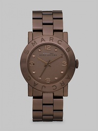 A delicious, chocolate-colored design with crystal markers and a signature bezel. Quartz movementWater resistant to 5 ATMRound brown ion-plated stainless steel case, 36mm (1.4)Logo etched bezelBrown dialCrystal and numeric markersSecond hand Brown ion-plated stainless steel link bracelet, 20mm wide (0.8)Imported A delicious, chocolate-colored design with crystal markers and a signature bezel. Quartz movementWater resistant to 5 ATMRound brown ion-plated stainless steel case, 36mm (1.4)Logo etched bezelBrown dialCrystal and numeric markersSecond hand Brown ion-plated stainless steel link bracelet, 20mm wide (0.8)Imported