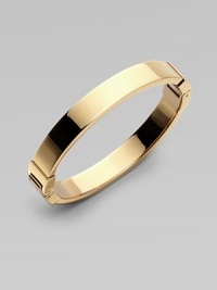 A thin goldtone design with hinge closure, perfect for stacking. Goldtone steelDiameter, about 2¾Hinged closureImported A thin goldtone design with hinge closure, perfect for stacking. Goldtone steelDiameter, about 2¾Hinged closureImported