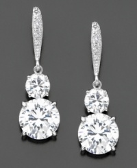Feel red carpet ready wearing these glamorous two round-cut cubic zirconia (6 ct. t.w) drop earrings with pavé crystals at the top. Rhodium plated. Drop measures 1-1/4 inch. Feel red carpet ready wearing these glamorous two round-cut cubic zirconia (6 ct. t.w) drop earrings with pavé crystals at the top. Rhodium plated. Drop measures 1-1/4 inch.