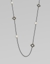 From the Midnight Pearl Collection. This lovely style features diamond accents, quatrefoils and lustrous pearl stations on a sleek, blackened sterling silver box chain. Blackened sterling silverWhite cultured South Sea pearlsDiamonds, .6 tcwLength, about 40Toggle closureImported 