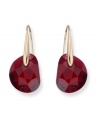 Drop-dead glamour. Bordeaux galet crystal drop earrings by Swarovski, set in gold-plated mixed metal. Approximate drop: 1 inch.