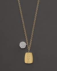 This gold necklace is engraved with LOVE and is paired with a diamond pavé medallion. Designed by Meira T. This gold necklace is engraved with LOVE and is paired with a diamond pavé medallion. Designed by Meira T.