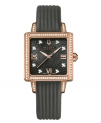 A penchant for drama is more than fine in the case of this Masella collection watch by Bulova Accutron. Ribbed black leather strap and square rose-gold tone stainless steel case with curved sapphire crystal. Case, bezel and dial embellished with 98 hand-set diamond accents. Black web-patterned dial features rose-gold tone numerals at three, six and nine o'clock, logo at twelve o'clock and three hands. Swiss quartz movement. Water resistant to 30 meters. Five-year limited warranty. A penchant for drama is more than fine in the case of this Masella collection watch by Bulova Accutron. Ribbed black leather strap and square rose-gold tone stainless steel case with curved sapphire crystal. Case, bezel and dial embellished with 98 hand-set diamond accents. Black web-patterned dial features rose-gold tone numerals at three, six and nine o'clock, logo at twelve o'clock and three hands. Swiss quartz movement. Water resistant to 30 meters. Five-year limited warranty.