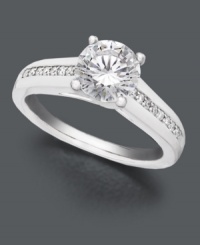 A timeless ring she will adore for years to come. Simplicity and sparkle combine with a luminous round-cut solitaire diamond (1-1/5 ct. t.w.). A glittering row of micro-prong diamonds (1/8 ct. t.w.) decorate the shank. Ring crafted in a polished 18k white gold setting. IGI Certified diamonds. A timeless ring she will adore for years to come. Simplicity and sparkle combine with a luminous round-cut solitaire diamond (1-1/5 ct. t.w.). A glittering row of micro-prong diamonds (1/8 ct. t.w.) decorate the shank. Ring crafted in a polished 18k white gold setting. IGI Certified diamonds.