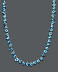 Cool down your look in icy blue hues. This vibrant necklace features a seamless row of round-cut blue topaz (45 ct. t.w.) set in sterling silver. Approximate length: 17 inches. Cool down your look in icy blue hues. This vibrant necklace features a seamless row of round-cut blue topaz (45 ct. t.w.) set in sterling silver. Approximate length: 17 inches.