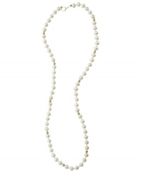 A dash of regal elegance, fit for the little lady. This simulated pearl necklace is studded with 14k gold beads and measures approximately 15 inches long.