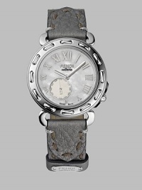 From the Selleria Collection. An elegant stainless steel timepiece with stitched detailing and an easily interchangeable leather strap. Swiss quartz movement Water-resistant to 5ATM Stitched bezel Round stainless steel case; 37mm diameter (1.46) Sapphire crystal Mother-of-pearl dial Roman numerals Off-center second hand sub dial Leather strap with hand-stitched accents and removable medallion Stainless steel buckle Made in Switzerland From the Selleria Collection. An elegant stainless steel timepiece with stitched detailing and an easily interchangeable leather strap. Swiss quartz movement Water-resistant to 5ATM Stitched bezel Round stainless steel case; 37mm diameter (1.46) Sapphire crystal Mother-of-pearl dial Roman numerals Off-center second hand sub dial Leather strap with hand-stitched accents and removable medallion Stainless steel buckle Made in Switzerland