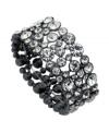 Add icy sparkle to a casual, corporate or cocktail look with this crystal-accented bracelet by GUESS. Crafted in hematite-plated mixed metal. Stretches to fit wrist. Approximate diameter: 2-1/4 inches.