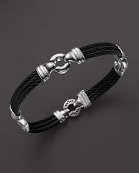 With 18K yellow gold details, Charriol's Nautical Cable station bracelet lends a timeless look. With 18K yellow gold details, Charriol's Nautical Cable station bracelet lends a timeless look.