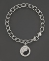 Sparkling sapphires form a brilliant yin yang, set in sterling silver. By Judith Ripka.