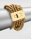 From the Modern Classics Collection. Bold and beautiful strands of polished beads with a glowing golden finish are connected to a striking turn-lock clasp in this sophisticated design.GoldtoneLength, about 7Width, about 1.75Turn-lock claspImported