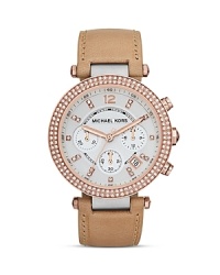 This Michael Kors watch is packed with all the stylish details that make it the perfect timepiece. From the leather wrist strap to the crystal detailing to the silver and rose gold tone finishing, this is your new must-have accessory. This Michael Kors watch is packed with all the stylish details that make it the perfect timepiece. From the leather wrist strap to the crystal detailing to the silver and rose gold tone finishing, this is your new must-have accessory.